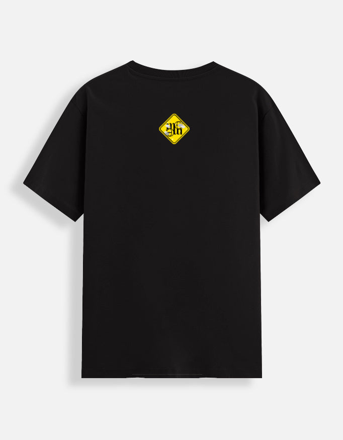 Black moonearth t-shirt with a yellow logo on the back against a light gray background