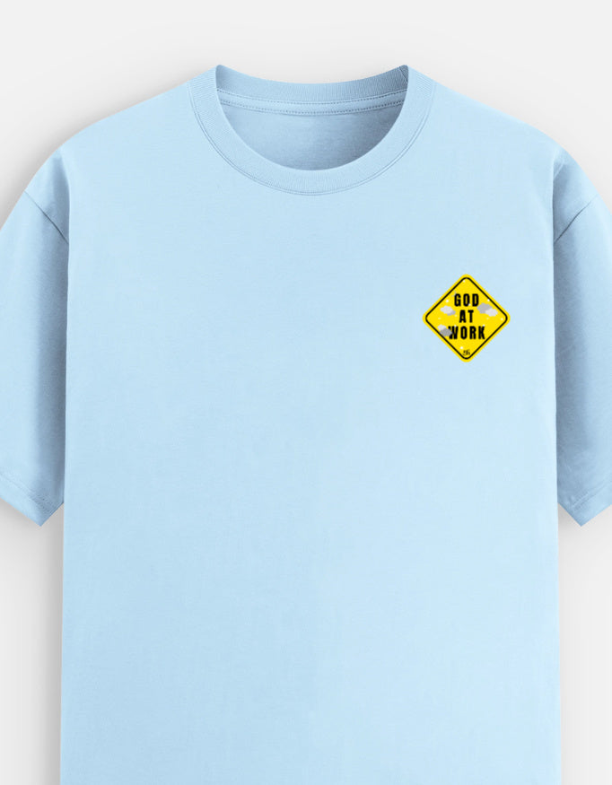 Light blue moonearth t-shirt with a yellow and black graphic on a light gray background