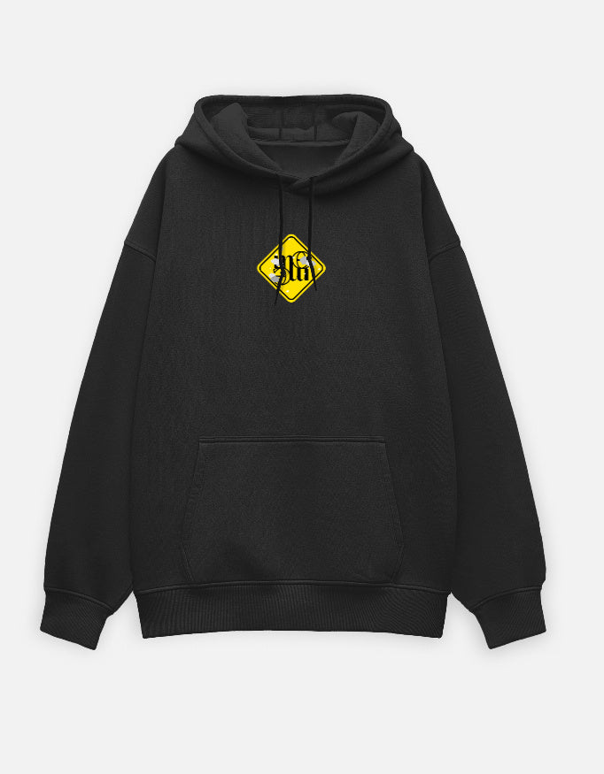 Black moonearth hoodie with a yellow logo on the chest against a light gray background