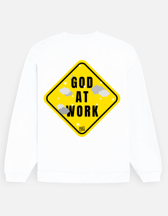 White moonearth sweatshirt with a yellow warning sign graphic and 'God at Work' text on a light gray background
