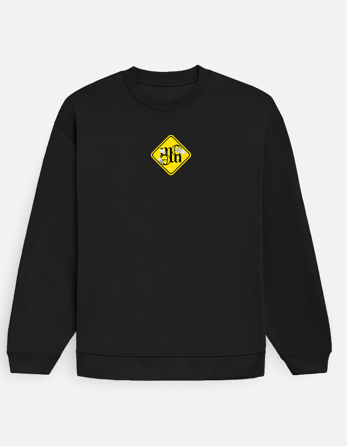 Black moonearth sweatshirt with a yellow logo on a light gray background