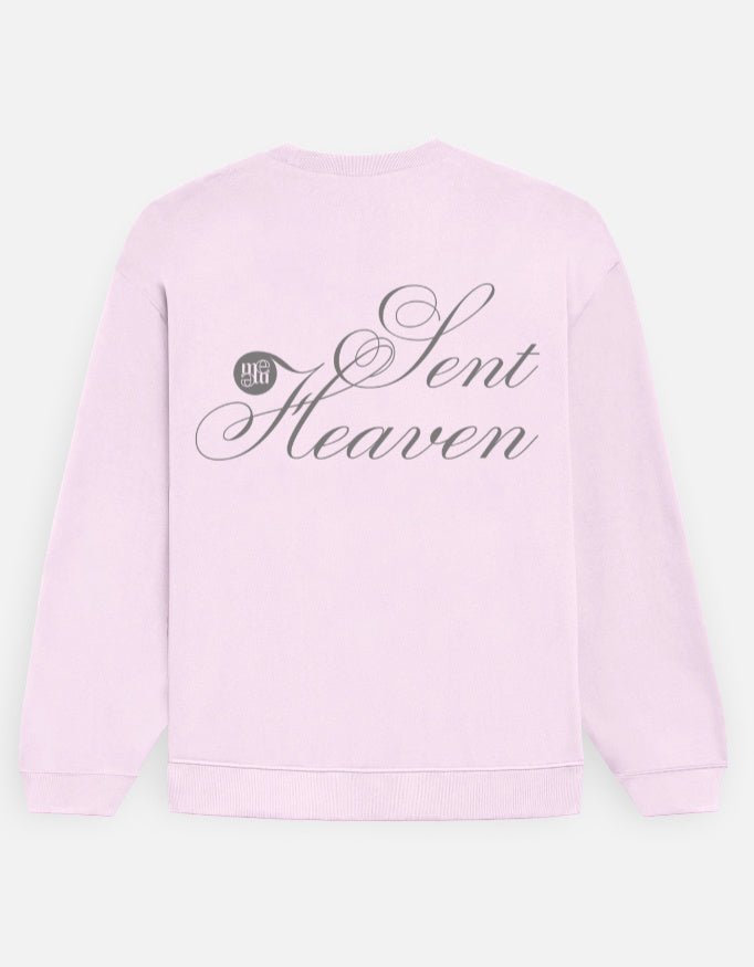 Light pink mooneaeth sweatshirt with 'Heaven Sent' text on a light gray background