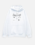 White hoodie with 'Moonearth' text and black polka dots on a light gray background