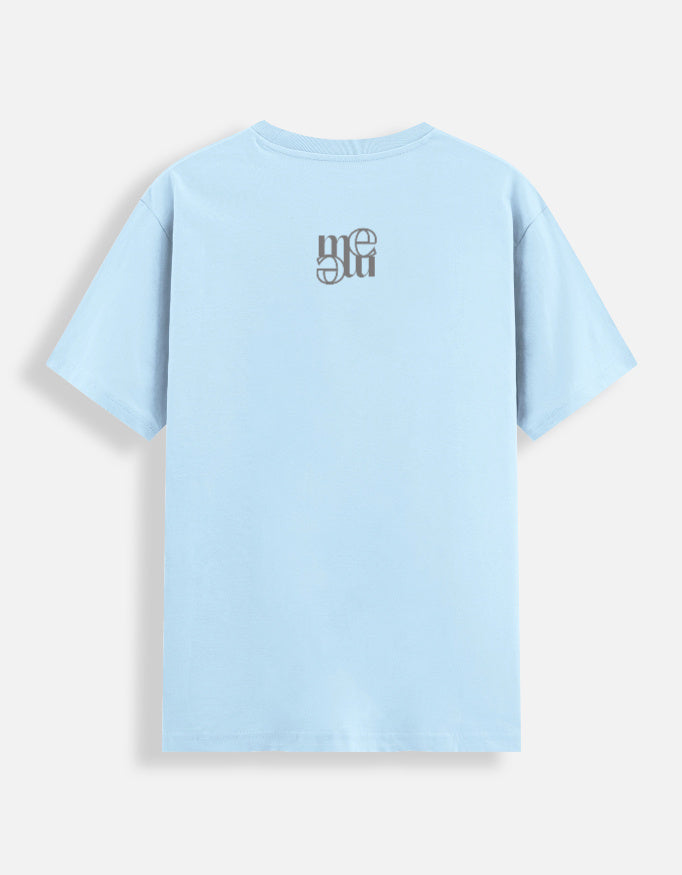 Light blue moonearth t-shirt with an embroidered logo on the back against a light gray background