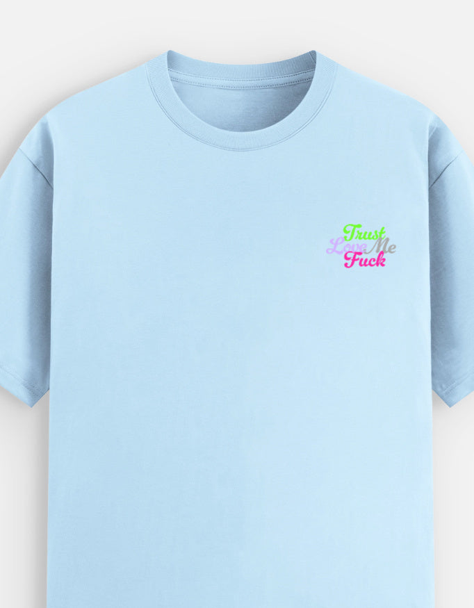 Light blue moonearth t-shirt with colorful embroidered text on a light gray background
