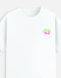 White moonearth t-shirt with colorful embroidered text design on a light gray background