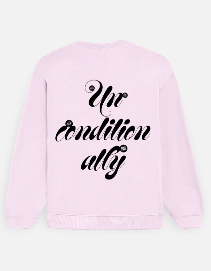 Baby pink moonearth sweatshirt with black 'Unconditionally' text on a light gray background